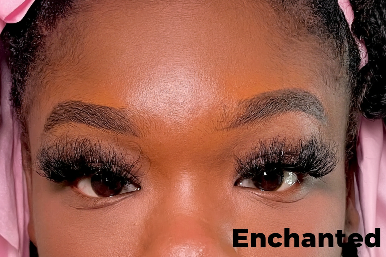 Close-up of a person's eyes with long eyelashes and pink headscarf