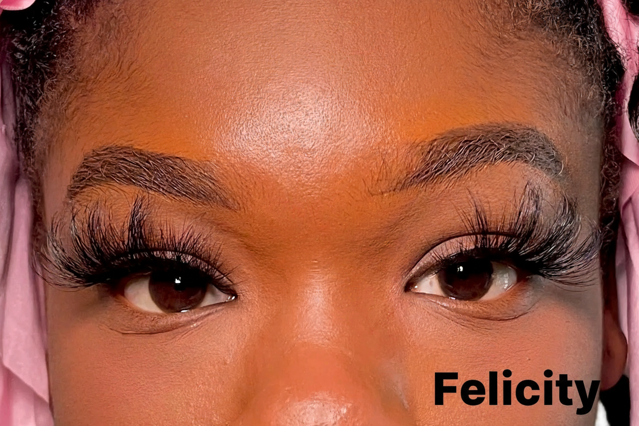 Close-up of a person's face with pink headscarf and false eyelashes